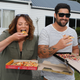 A robot delivered this happy couple a pizza from the sky.